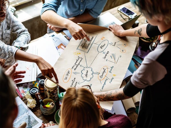 colleagues-working-at-desk